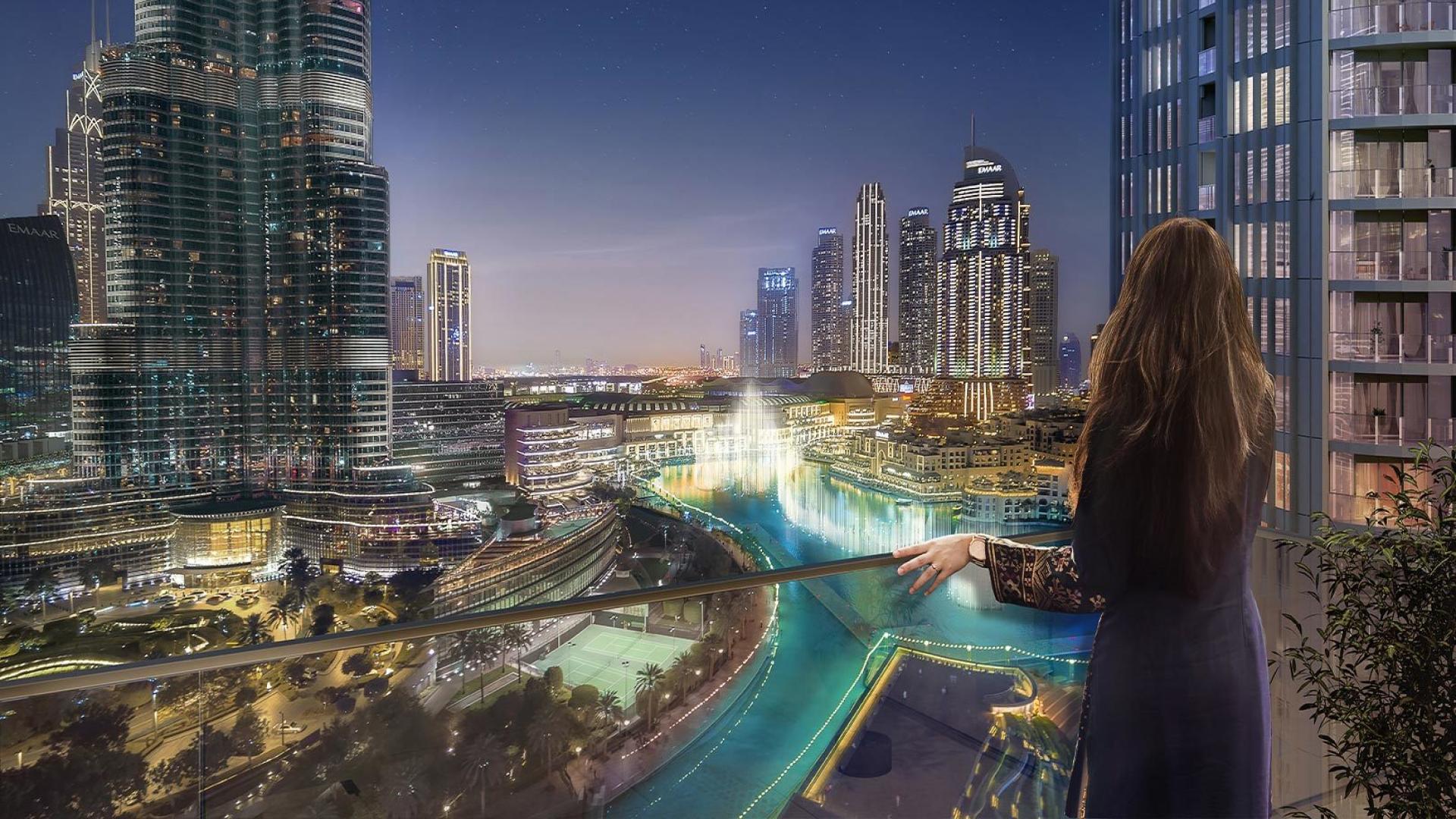 Terrasse d'appartement la nuit avec vue sur la Burj Khalifa, le Dubai Mall et les fontaines illuminées de Downtown Dubai