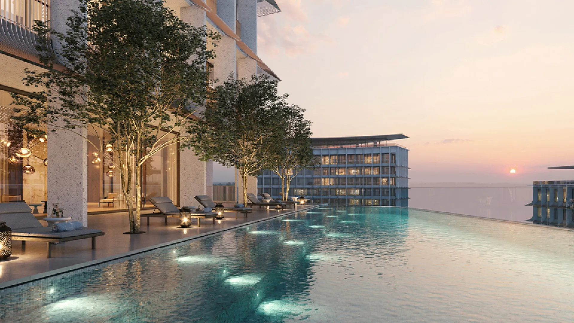 Piscine à débordement des Four Seasons Private Residences au coucher du soleil